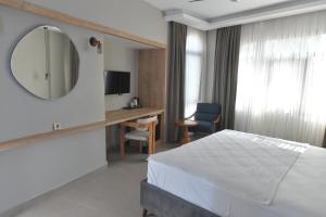 TV a/nebo společenská místnost v ubytování Casalita Hotel