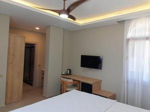 TV a/nebo společenská místnost v ubytování Casalita Hotel