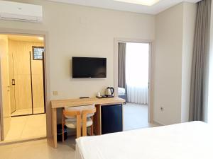TV a/nebo společenská místnost v ubytování Casalita Hotel