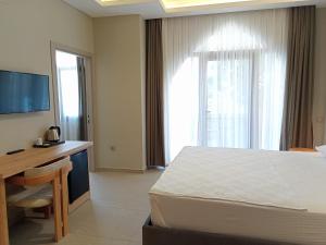 TV a/nebo společenská místnost v ubytování Casalita Hotel