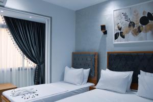 Voodi või voodid majutusasutuse Olivia Hotel toas