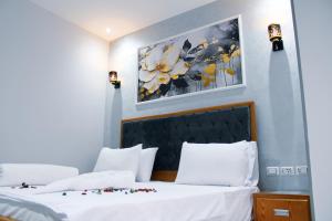 Voodi või voodid majutusasutuse Olivia Hotel toas