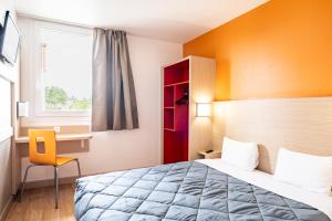 Llit o llits en una habitació de Première Classe Roissy - Aéroport CDG - Le Mesnil-Amelot