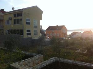 a view of a house and some buildings at Apartments Villa Novak in Slano