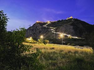 a mountain with lights on top of it at night at Residenza Matilde in Fiumefreddo Bruzio