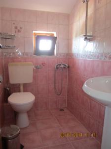 a bathroom with a toilet and a sink at Guesthouse Olimp in Sozopol