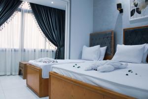 Voodi või voodid majutusasutuse Olivia Hotel toas