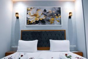 Voodi või voodid majutusasutuse Olivia Hotel toas