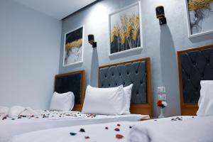 Voodi või voodid majutusasutuse Olivia Hotel toas
