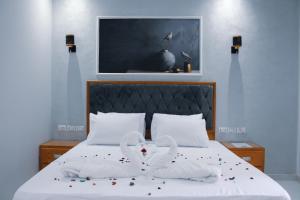 Voodi või voodid majutusasutuse Olivia Hotel toas
