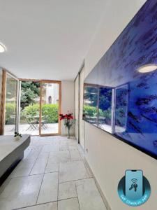 a hallway with a large painting on the wall at Anabella Apartment in Izola
