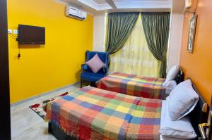 Katil atau katil-katil dalam bilik di aswan view 3 bedrooms
