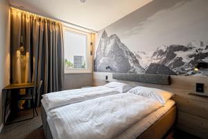 Postel nebo postele na pokoji v ubytování Zleep Hotel Lausanne-Chavannes