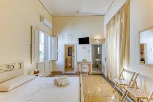 A bed or beds in a room at La Corte dei Mille