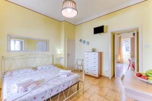 Postel nebo postele na pokoji v ubytování La Corte dei Mille