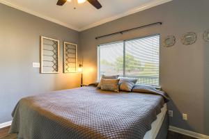 a bedroom with a large bed with a window at Lake Conroe Condo with Pool Access and Balcony! in Montgomery +19 photos