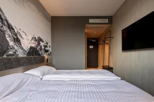 Postel nebo postele na pokoji v ubytování Zleep Hotel Lausanne-Chavannes