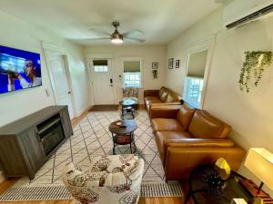 a living room with a couch and a fireplace at Modern Cottage Downtown. Pet Yes in Beaufort