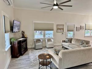 a living room with a couch and a table at Newest Cottage Downtown. Pet Yes in Beaufort