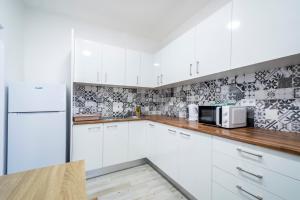 Kuchyň nebo kuchyňský kout v ubytování GrowIN Stay Mercado