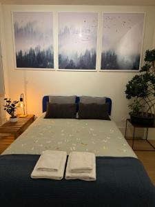 Giường trong phòng chung tại Magnífico quarto com WC privativo Augusta Street