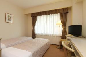 TV a/nebo společenská místnost v ubytování Hotel Green Tower Makuhari