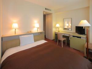 Postel nebo postele na pokoji v ubytování Hotel Green Tower Makuhari + 28 fotografií