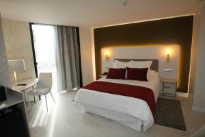 Posteľ alebo postele v izbe v ubytovaní Hotel Cardenal