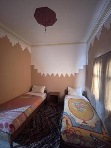 Postel nebo postele na pokoji v ubytování Taghadoute Hotel