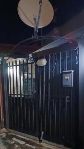 a black gate in a room with a ceiling at Casa Matì in Trecastagni