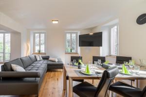 a living room with a couch and a table at Lischana 410 in Scuol