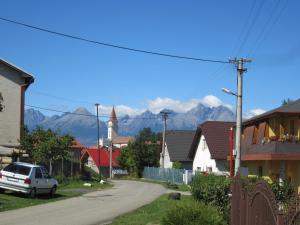 a street in a town with mountains in the background at Privat Vrbov 23 in Vrbov