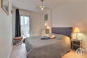 a bedroom with a bed with a pillow on it at Le sens de breizh in Sens-de-Bretagne
