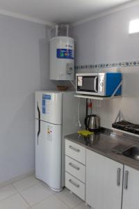 Cuisine ou kitchenette dans l'établissement Departamentos La Justina