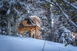 a log cabin in the woods in the snow at Cabanes Chartreuse insolite - La Trafolle in Saint-Pierre-de-Chartreuse