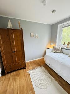 Ένα ή περισσότερα κρεβάτια σε δωμάτιο στο Inselperle