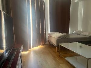 Ένα ή περισσότερα κρεβάτια σε δωμάτιο στο Oslo Resident 7