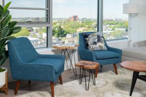 a living room with two chairs and a couch at Central Serene Condo King Bed by MIT Harvard GYM in Cambridge