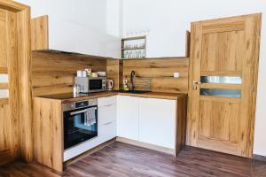 Kuhinja oz. manjša kuhinja v nastanitvi Apartmány pri Jaskyni - Bystrá