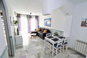 a living room with a couch and a table at Rincón de Sierra Nevada in Cenes de la Vega