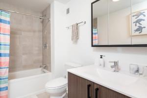 a bathroom with a sink and a toilet and a shower at Central Serene Condo King Bed by MIT Harvard GYM in Cambridge +48 photos