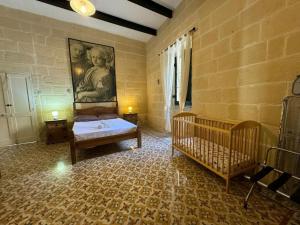 Postel nebo postele na pokoji v ubytování Ta Speranza Farmhouse B&B