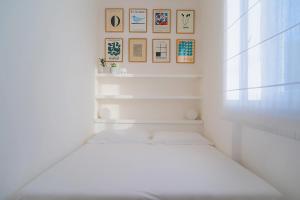 A bed or beds in a room at La Guardiola - Capo Perla