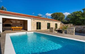 a swimming pool in front of a house at 4 Bedroom Cozy Home In Krusevo in Kruševo +41 photos