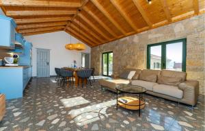 a living room with a couch and a table at 4 Bedroom Cozy Home In Krusevo in Kruševo