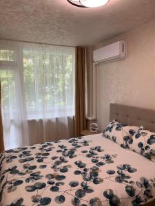 Postel nebo postele na pokoji v ubytování Апартамент Easy Lux