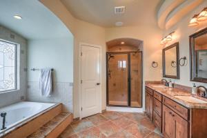 a bathroom with a tub and two sinks and a shower at The Palo in Alamogordo +45 photos