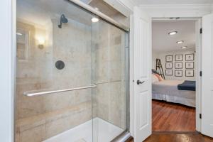 a glass shower in a bathroom with a bedroom at 10 Seventh Street Harwich Cape Cod- -Cape Vista in Harwich +41 photos