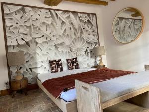 a bedroom with a bed with a wall mural at demeure de luxe, piscine sauna billard pétanque in Yèvre-le-Châtel +30 photos