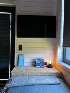 Katil atau katil-katil dalam bilik di Lykke Huus Tinyhaus am Meer mit Fasssauna